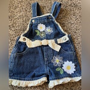 Young Hearts size 2T denim overalls. Yellow checkered bow and flowers.